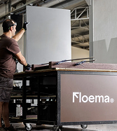 A specialist preparing a large display